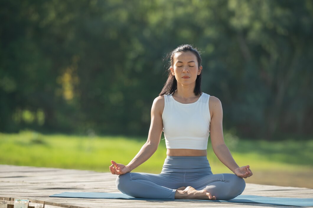 woman-yoga-mat-relax-park-mountain-lake-calm-woman-with-closed-eyes-practicing-yoga-sitting-padmasana-pose-mat-lotus-exercise-attractive-sporty-girl-sportswear_1150-44679